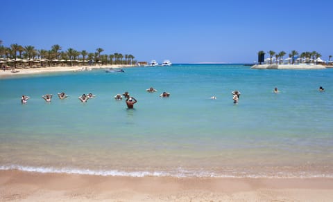 Private beach, free beach shuttle, sun loungers, beach umbrellas