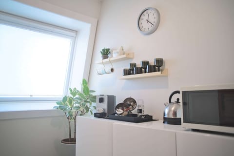 Suite, 1 Queen Bed | Private kitchenette | Eco-friendly cleaning products, reusable coffee/tea filters