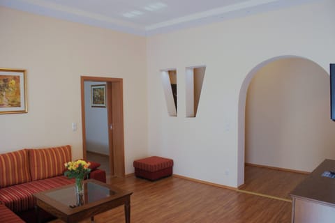 Superior Suite | Living area | 32-inch LED TV with satellite channels