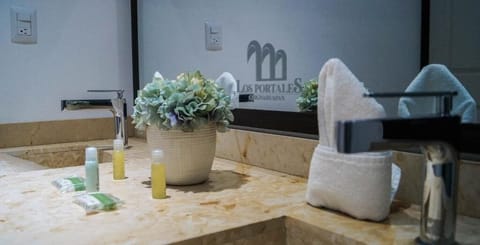 Shower, rainfall showerhead, towels, soap