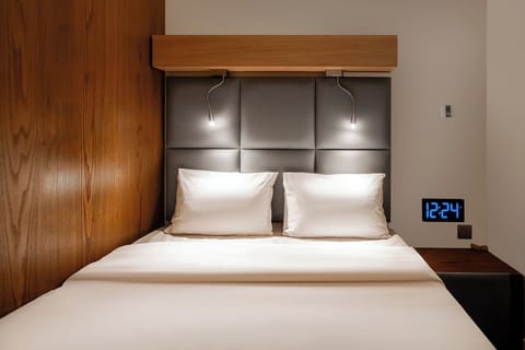 Laptop workspace, bed sheets