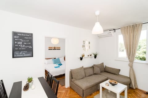Standard Apartment, 1 Bedroom | Living room | Flat-screen TV