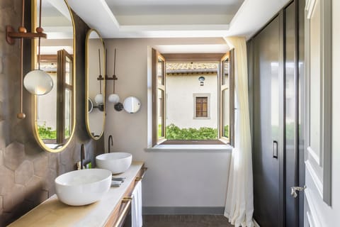 Designer toiletries, hair dryer, bathrobes, slippers