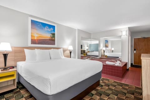 Standard Room, 1 King Bed, Jetted Tub | Desk, iron/ironing board, free cribs/infant beds, rollaway beds