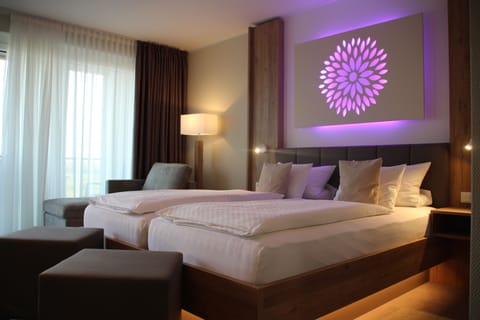 Hypo-allergenic bedding, down comforters, pillowtop beds, in-room safe