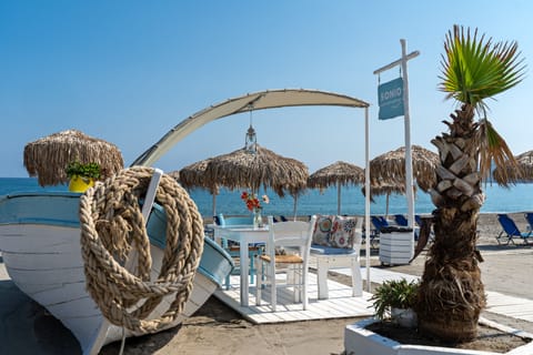 On the beach, sun loungers, beach umbrellas, beach towels