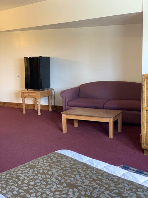 Family Room, 2 Queen Beds | Desk, laptop workspace, blackout drapes, iron/ironing board