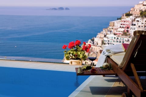 Seasonal outdoor pool, open 9:00 AM to 8:00 PM, pool umbrellas