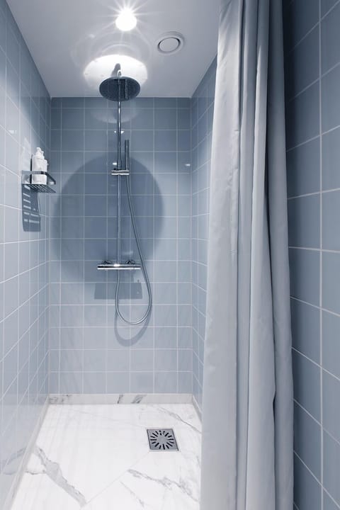 Shower, rainfall showerhead, hair dryer, towels