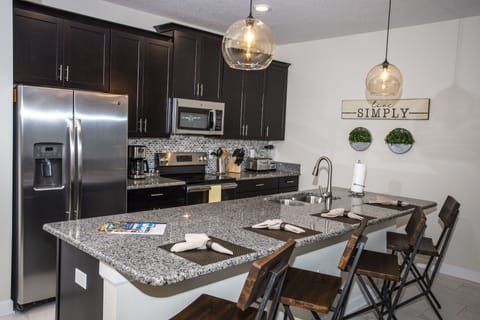 Townhome, 4 Bedrooms | Private kitchenette | Full-size fridge, microwave, oven, stovetop
