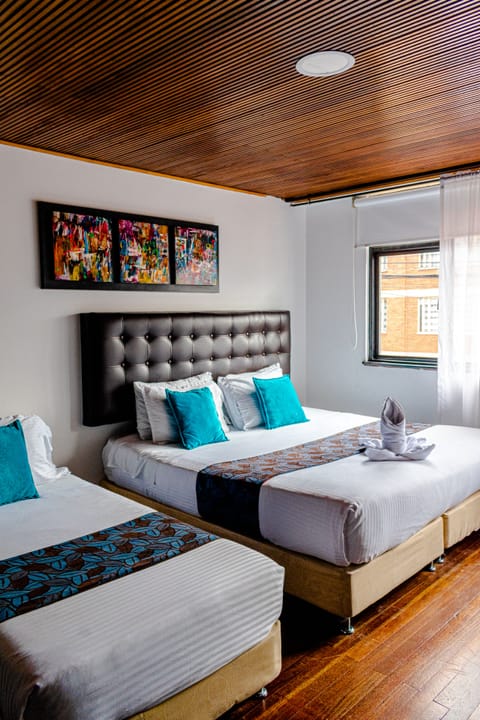 Triple Room | Individually decorated, desk, blackout drapes, free WiFi