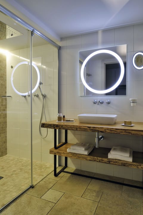 Eco-friendly toiletries, hair dryer, slippers, towels