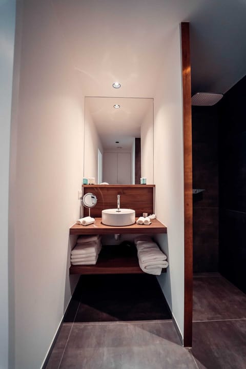 Family Suite, 4 Bedrooms, Garden View, Garden Area | Bathroom | Combined shower/tub, rainfall showerhead, free toiletries, hair dryer