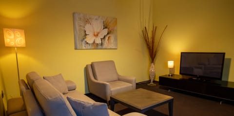 Junior Suite, 1 Bedroom, City View | Living area | 43-inch Smart TV with cable channels, TV