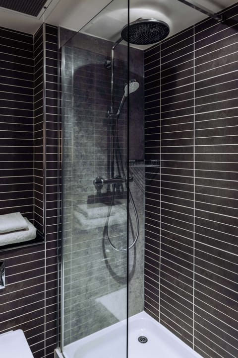 Hypo-allergenic bedding, desk, laptop workspace, blackout drapes