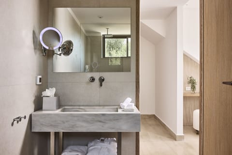 Combined shower/tub, designer toiletries, hair dryer, bathrobes