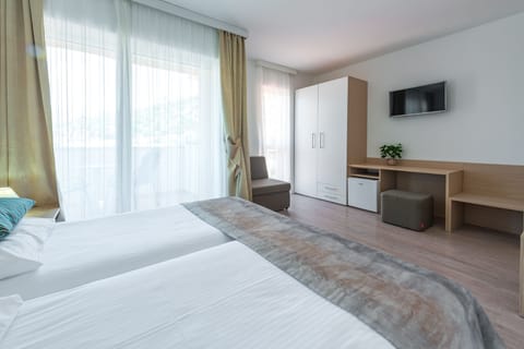 Twin Room, Balcony, Sea View | In-room safe, desk, iron/ironing board, bed sheets