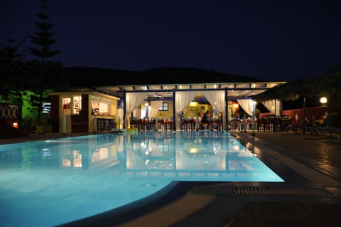 Seasonal outdoor pool, open 8:00 AM to 9:00 PM, pool umbrellas
