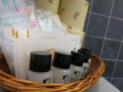 Deluxe Studio, 1 Bedroom | Bathroom amenities | Shower, free toiletries, hair dryer, slippers