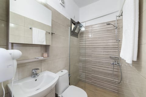 Shower, free toiletries, hair dryer, slippers