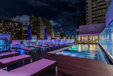Outdoor pool, open 6:00 AM to 10:00 PM, pool umbrellas, sun loungers