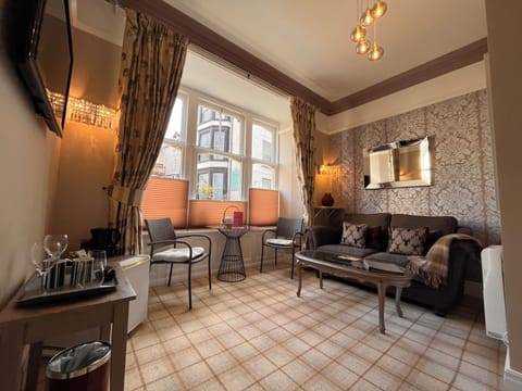 Suite, Balcony (Rydal) | Living area | TV, fireplace