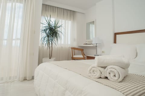 Deluxe Duplex, Partial Sea View | In-room safe, blackout drapes, soundproofing, iron/ironing board