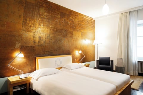 Hypo-allergenic bedding, down comforters, minibar, in-room safe