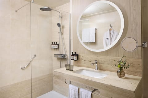 Bathtub, eco-friendly toiletries, hair dryer, bidet