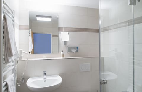 Hair dryer, towels, soap, shampoo