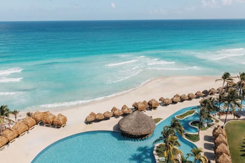 On the beach, white sand, beach umbrellas, beach towels