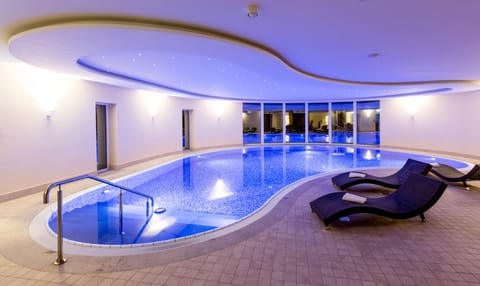 Indoor pool, open 6:00 AM to 10:00 PM, sun loungers