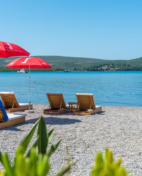 Private beach, sun loungers, beach umbrellas, beach towels