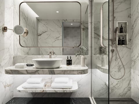 Designer toiletries, hair dryer, bathrobes, slippers