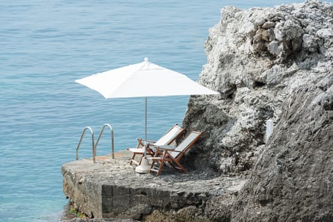Private beach, black sand, free beach shuttle, sun loungers