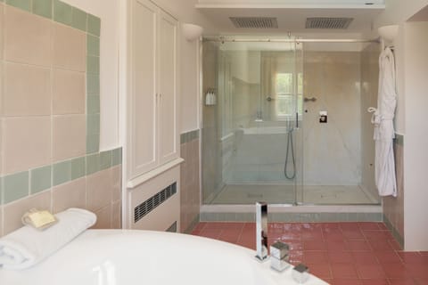 Signature Suite | Bathroom | Designer toiletries, hair dryer, bathrobes, slippers