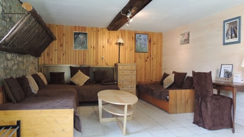 Standard Quadruple Room | Living area | 35-inch flat-screen TV with cable channels, TV