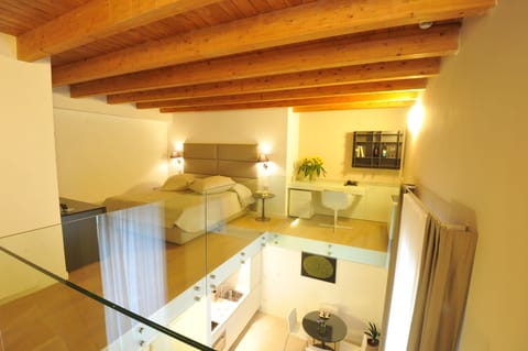 Deluxe Apartment | Down comforters, memory foam beds, in-room safe, desk