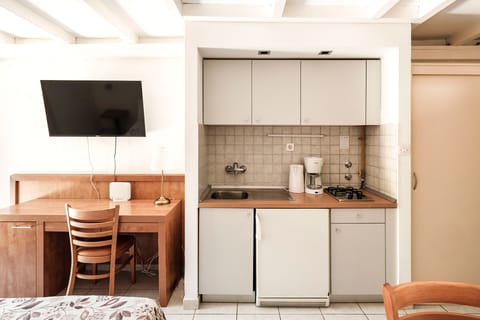 Fridge, microwave, coffee/tea maker, cookware/dishes/utensils