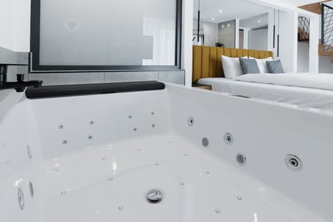 Junior Suite, Jetted Tub | Down comforters, in-room safe, desk, blackout drapes