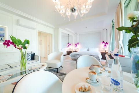 Deluxe Suite, Balcony, Sea View (Tosca) | Living area | Flat-screen TV, heated floors