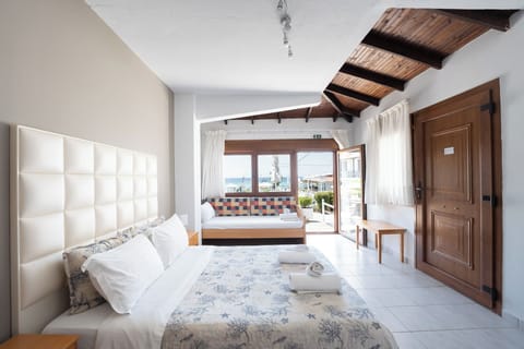 Comfort Triple Room (Villa Building) | Minibar, in-room safe, desk, laptop workspace