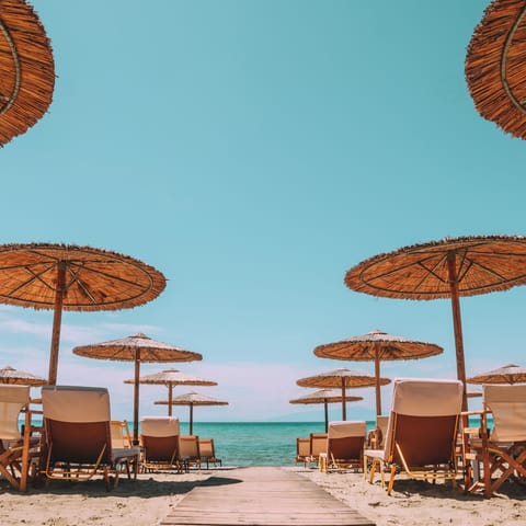On the beach, sun loungers, beach umbrellas, beach bar
