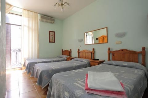 Basic Triple Room, Private Bathroom | In-room safe, free WiFi