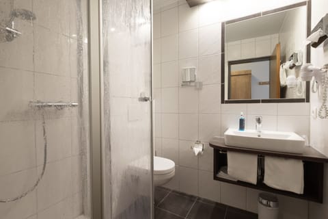 Shower, eco-friendly toiletries, hair dryer, towels