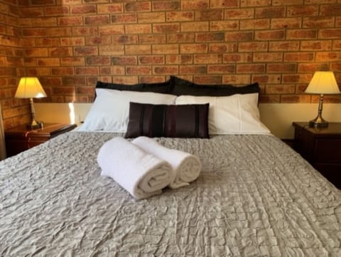 Family Room, 2 Queen Beds | Desk, laptop workspace, blackout drapes, iron/ironing board