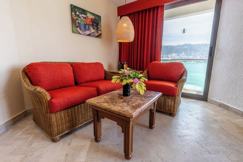 Junior Double Room, 1 King Bed, Ocean View | Living area | 32-inch plasma TV with cable channels, TV