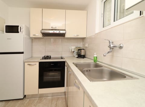 House (Three Bedroom Holiday Home) | Private kitchen | Fridge, electric kettle, dining tables