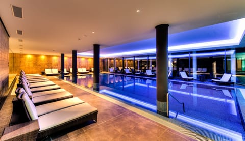 Indoor pool, open 7:00 AM to 10:00 PM, sun loungers