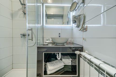 Deluxe Double or Twin Room, Terrace, Sea View | Bathroom | Shower, rainfall showerhead, hair dryer, slippers